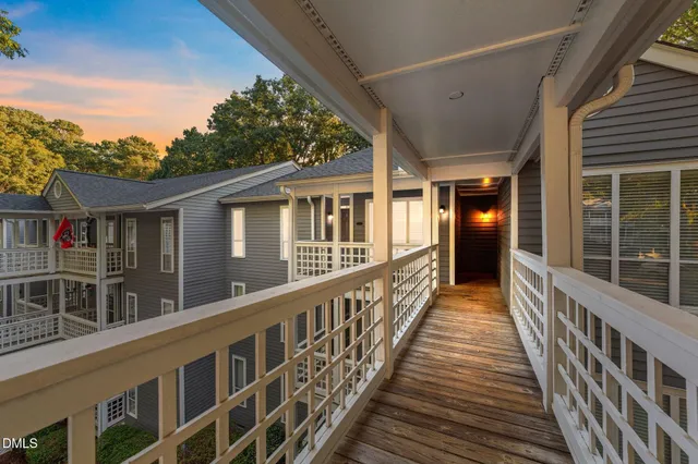 a view of a house with wooden deck