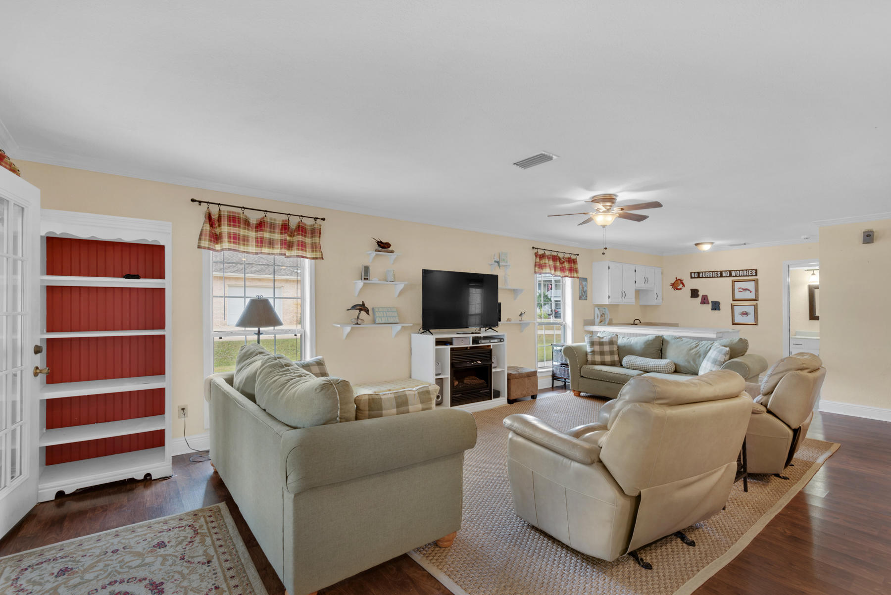 44 Dolphin Place Freeport, FL 32439 - Photo 16 of 76 a living room with furniture and a flat screen tv