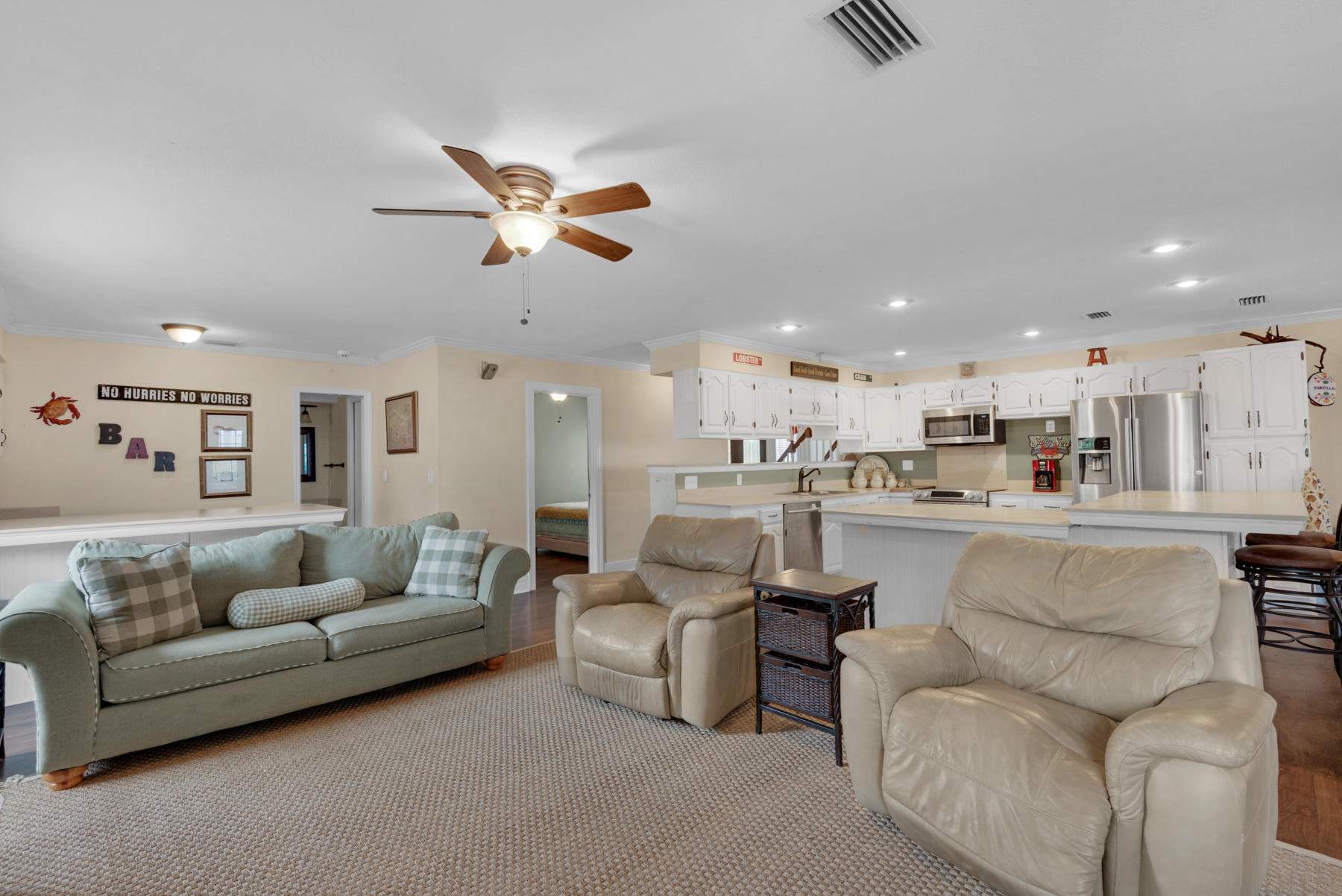 44 Dolphin Place Freeport, FL 32439 - Photo 17 of 76 a living room with furniture kitchen view and a chandelier