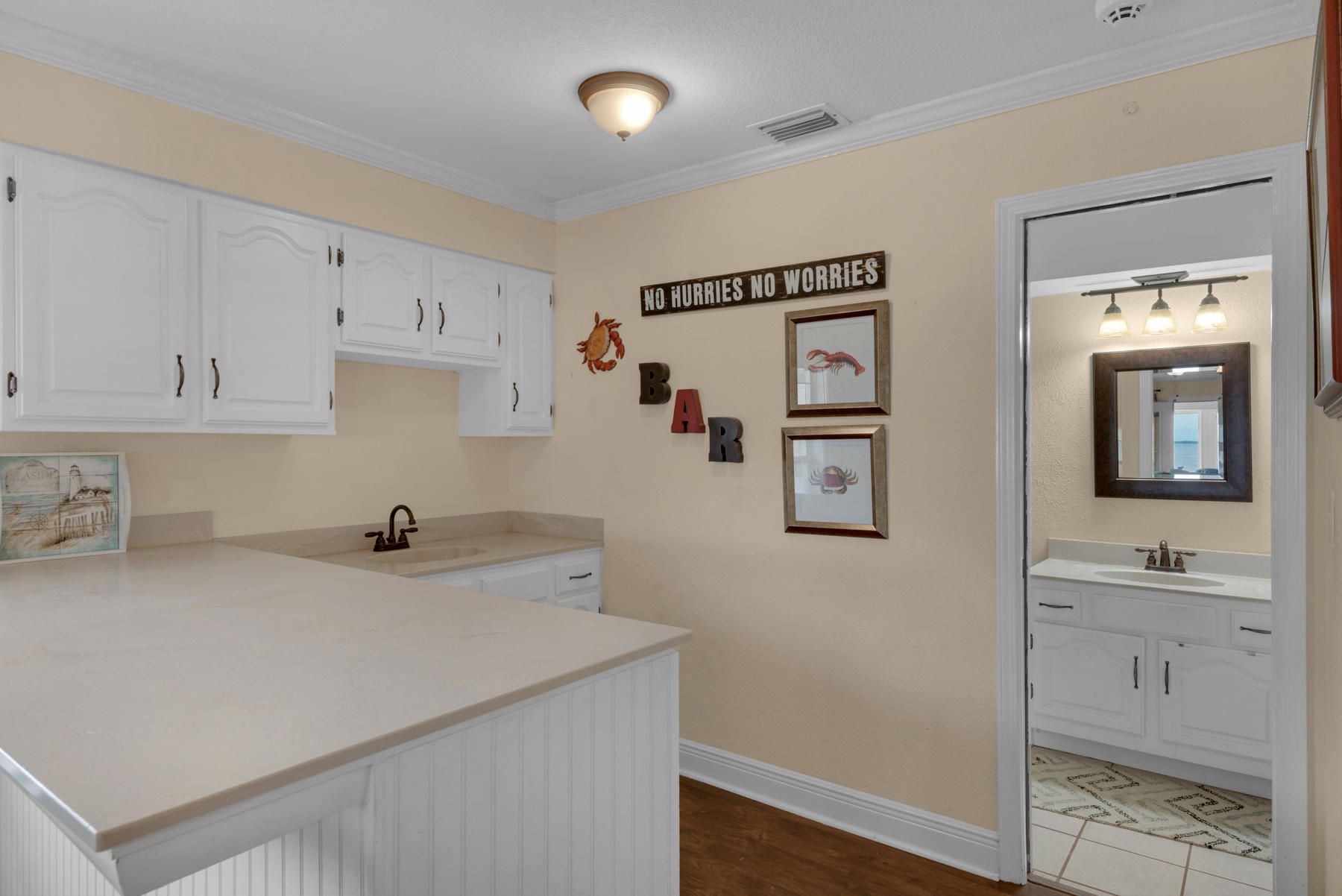 44 Dolphin Place Freeport, FL 32439 - Photo 19 of 76 a kitchen with a sink a stove and cabinets