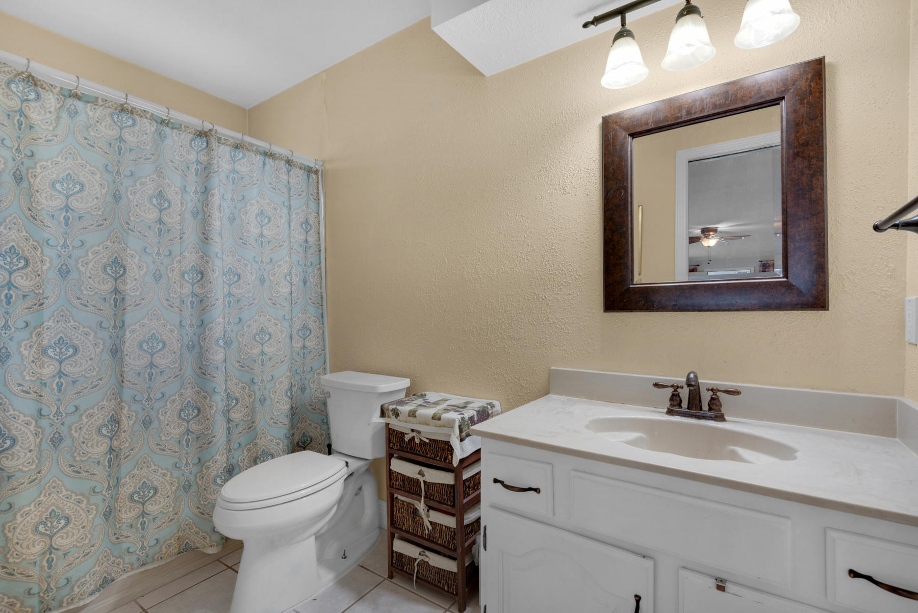 44 Dolphin Place Freeport, FL 32439 - Photo 20 of 76 a bathroom with a toilet a sink and mirror