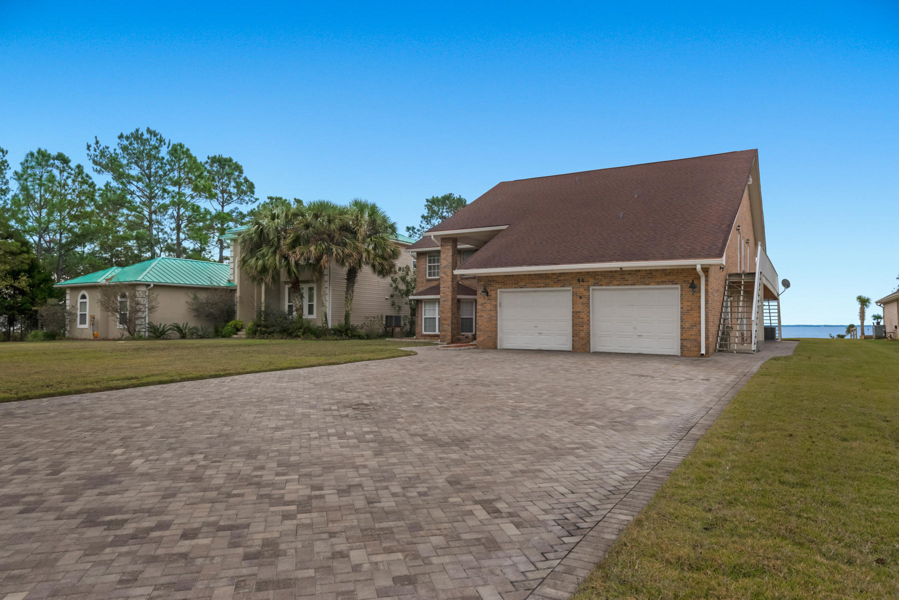 44 Dolphin Place Freeport, FL 32439 - Photo 2 of 76 a house view with a outdoor space
