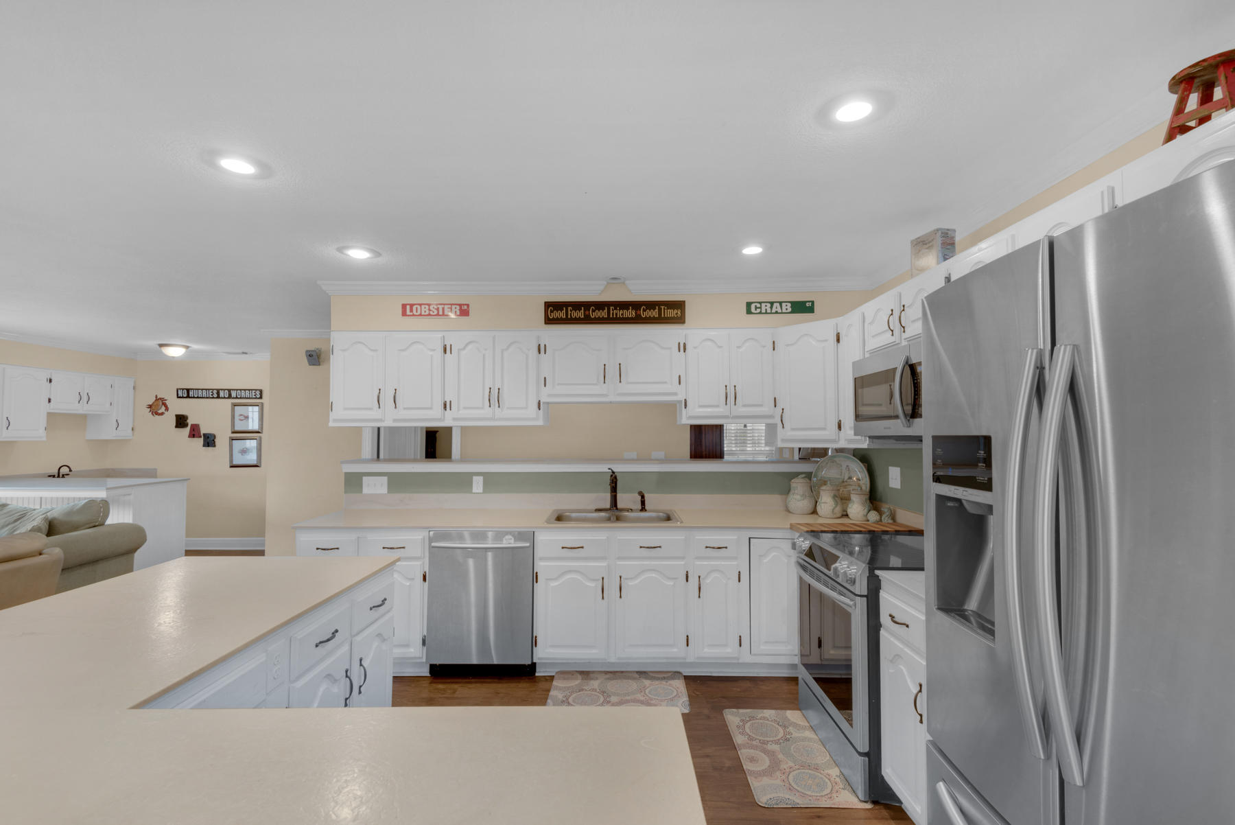 44 Dolphin Place Freeport, FL 32439 - Photo 25 of 76 a large kitchen with stainless steel appliances lots of counter top space and cabinets