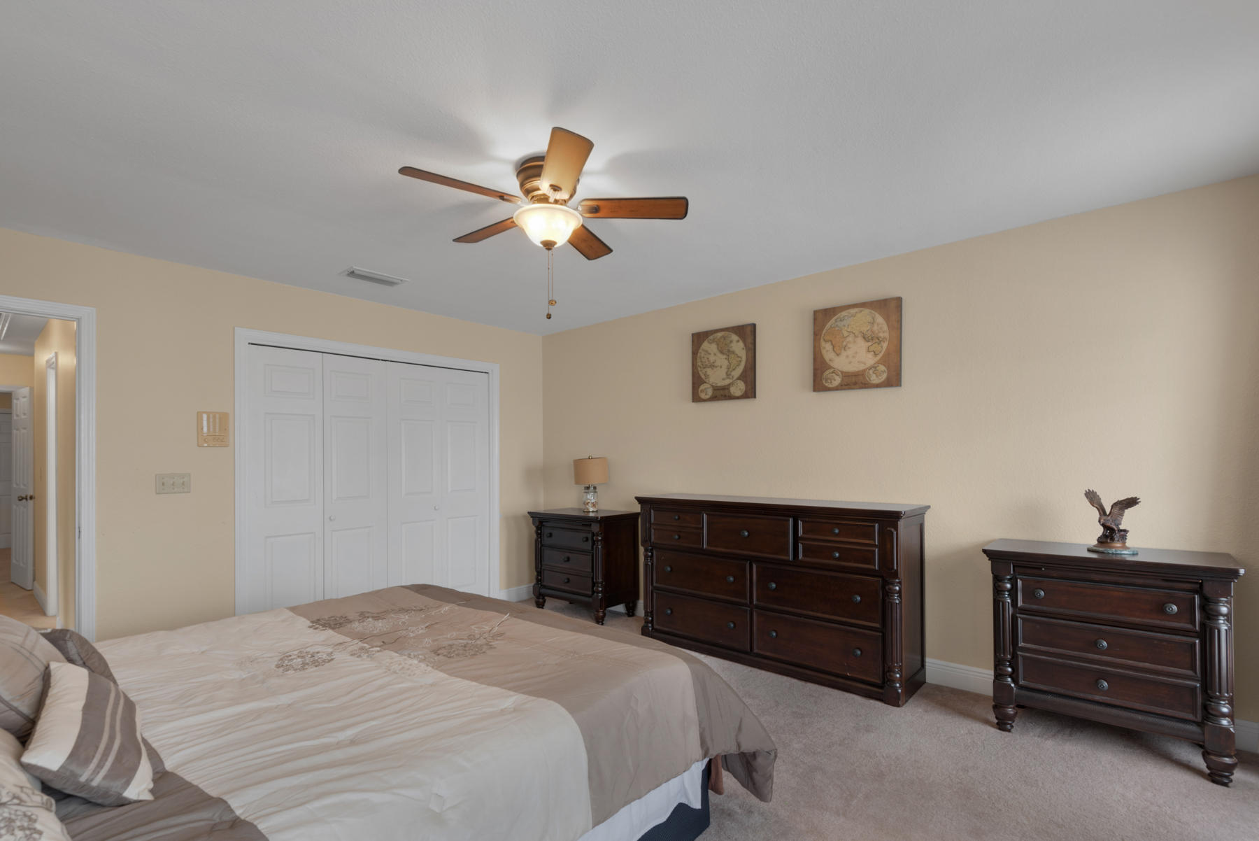 44 Dolphin Place Freeport, FL 32439 - Photo 32 of 76 a bedroom with a bed and a dresser