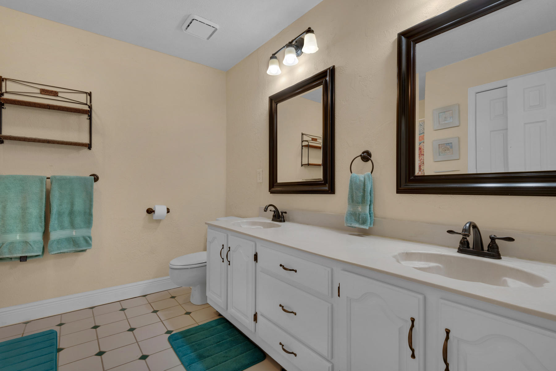 44 Dolphin Place Freeport, FL 32439 - Photo 34 of 76 a bathroom with a double vanity sink mirror and toilet