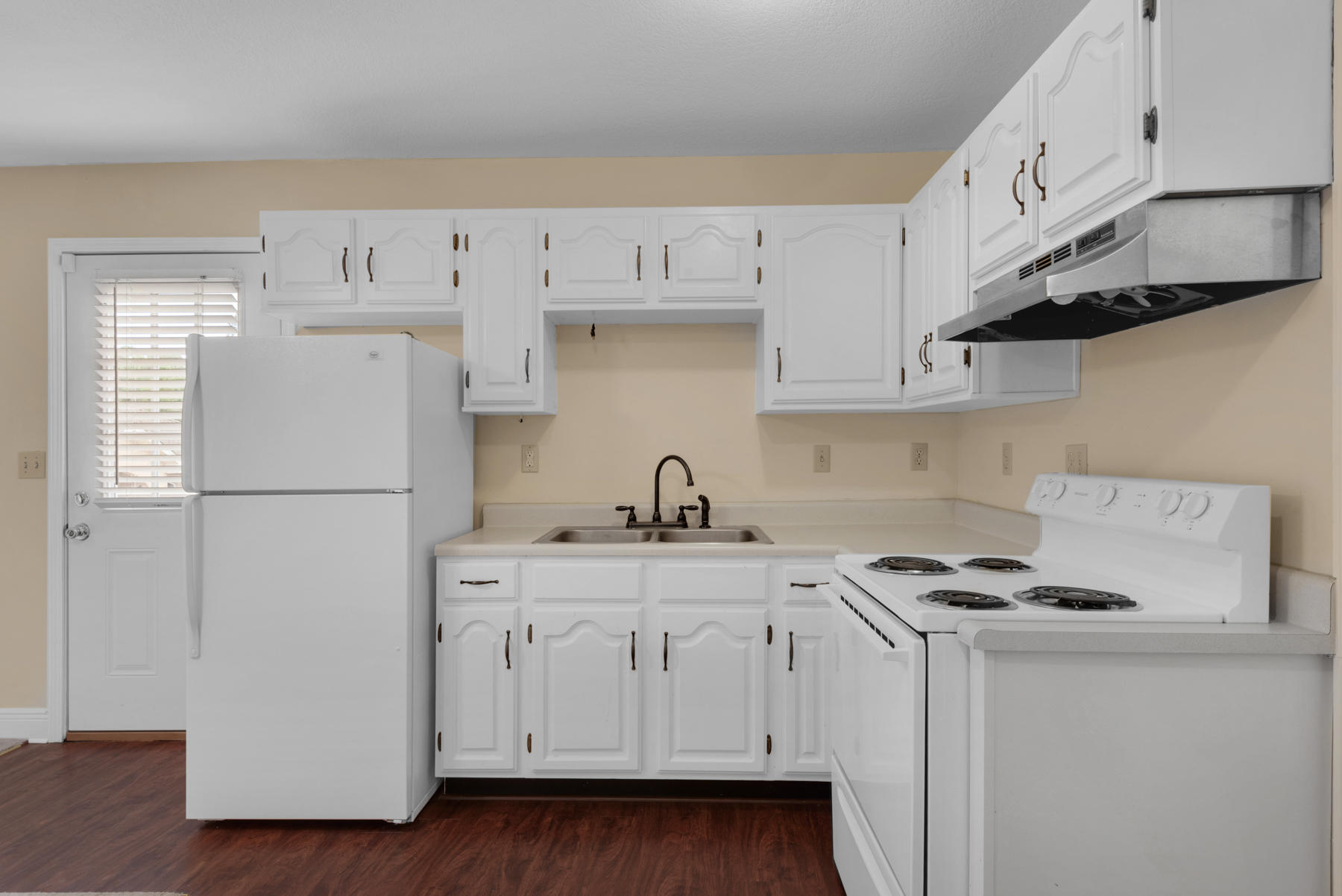 44 Dolphin Place Freeport, FL 32439 - Photo 38 of 76 a kitchen with stainless steel appliances white cabinets and a refrigerator