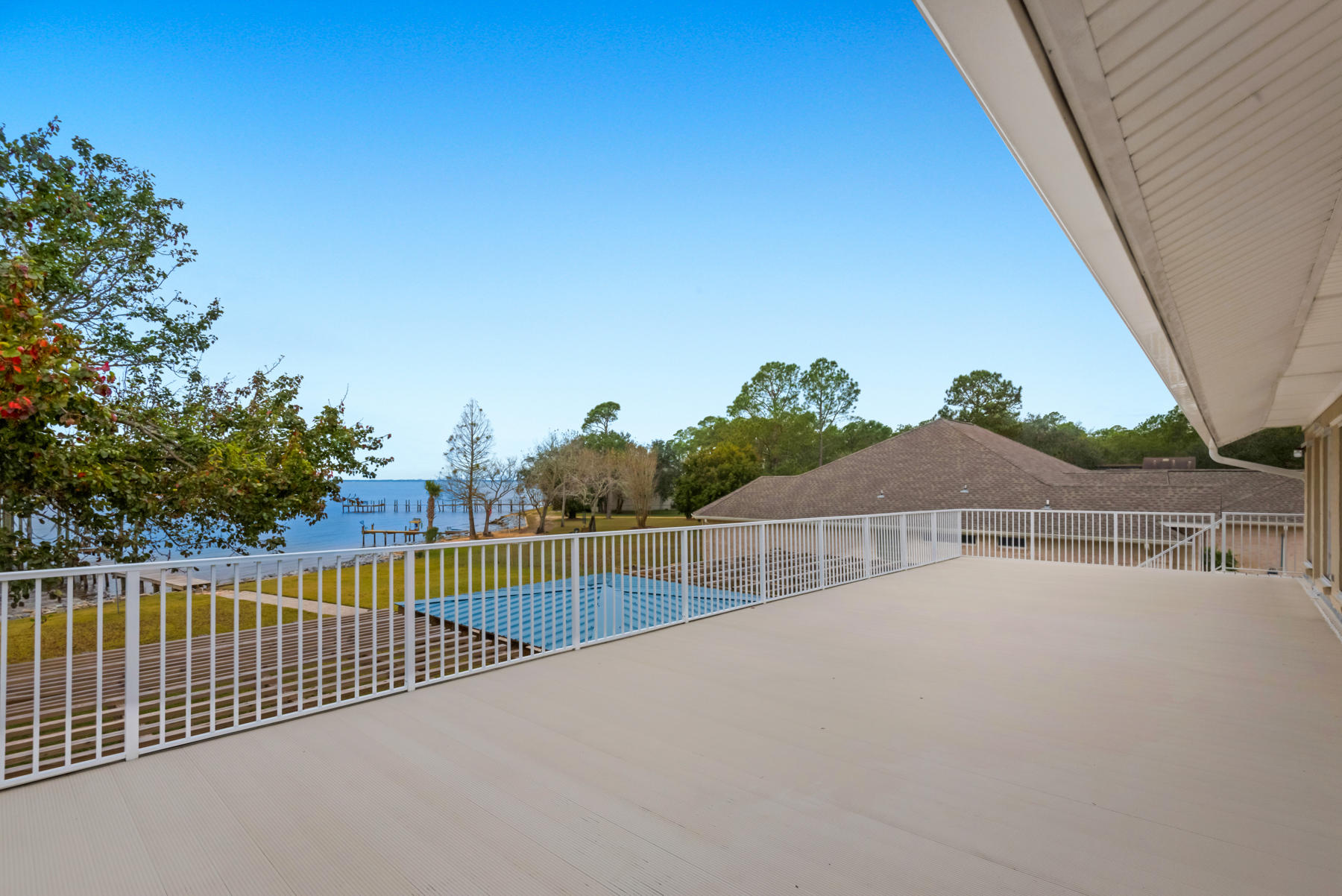44 Dolphin Place Freeport, FL 32439 - Photo 47 of 76 a view of a roof deck with wooden fence and plants