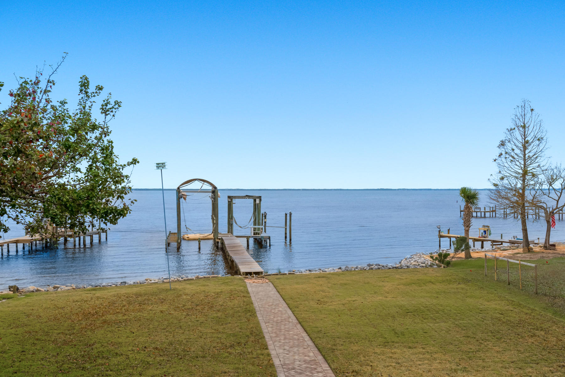 44 Dolphin Place Freeport, FL 32439 - Photo 48 of 76 a view of a lake with a yard