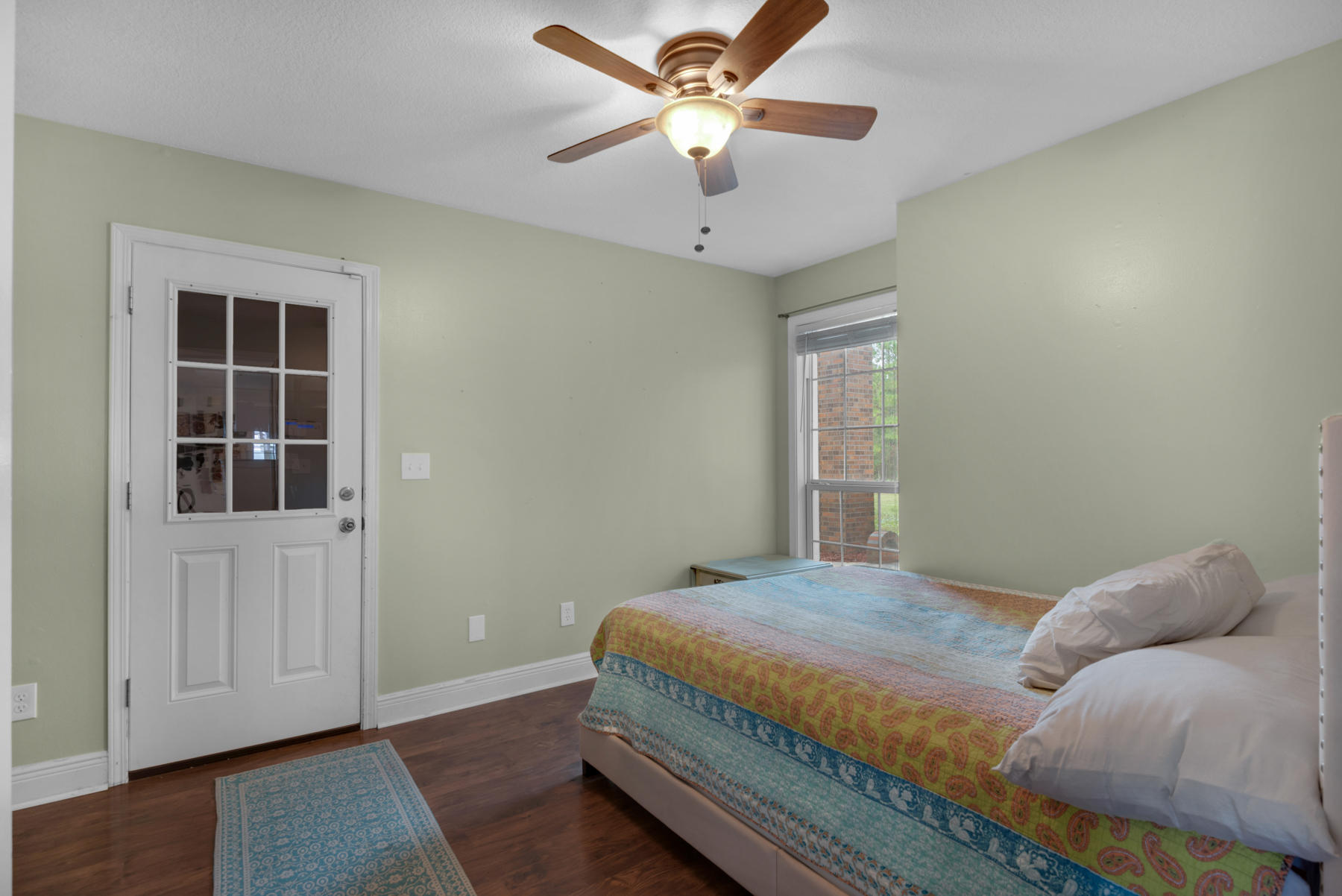 44 Dolphin Place Freeport, FL 32439 - Photo 61 of 76 a bedroom with a large bed and a window