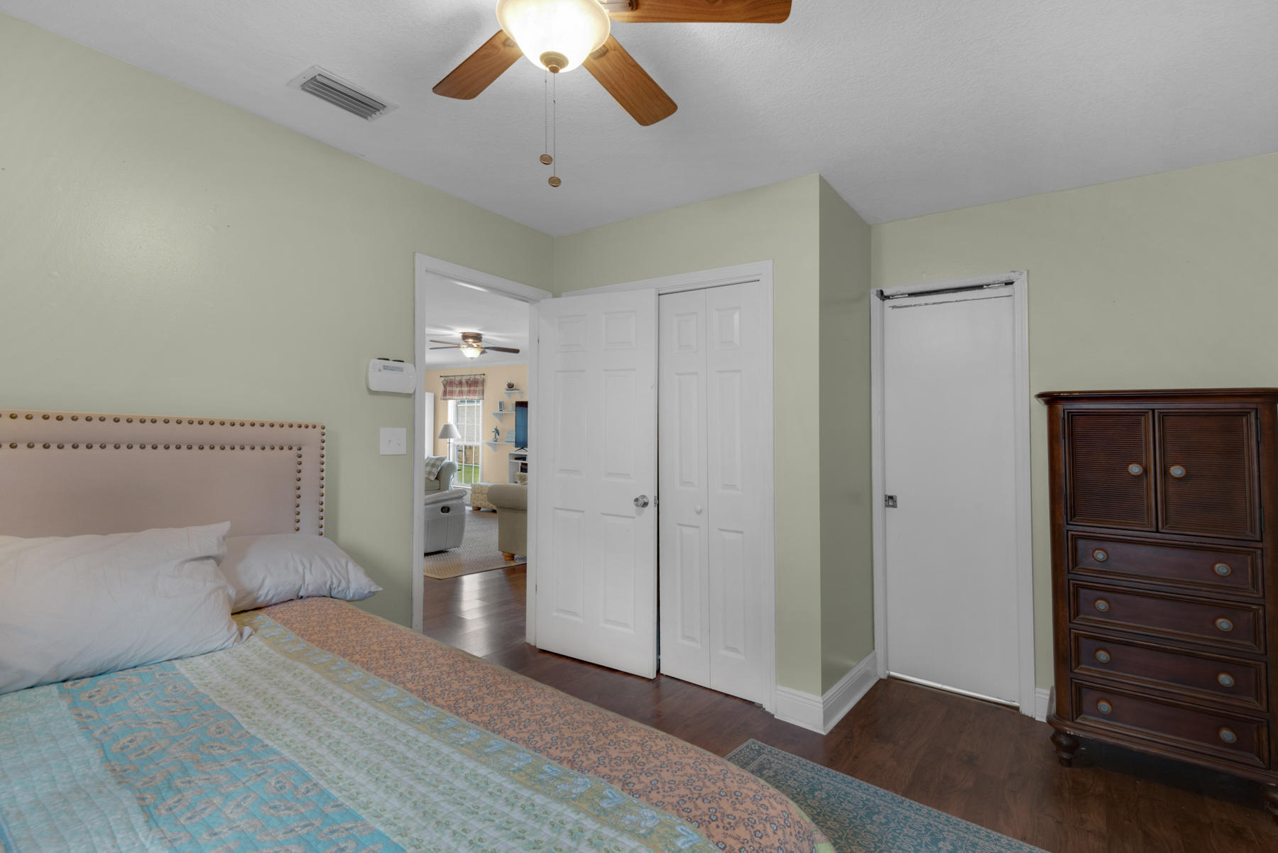44 Dolphin Place Freeport, FL 32439 - Photo 62 of 76 a spacious bedroom with a bed and a dresser