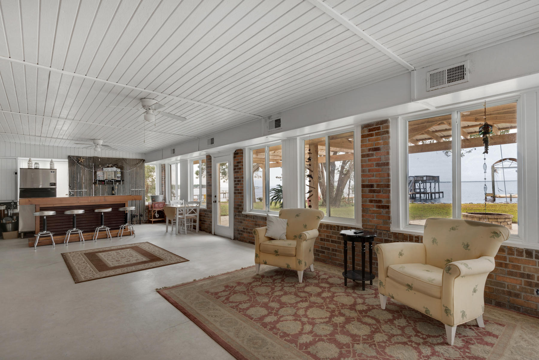 44 Dolphin Place Freeport, FL 32439 - Photo 63 of 76 a living room with furniture and large windows