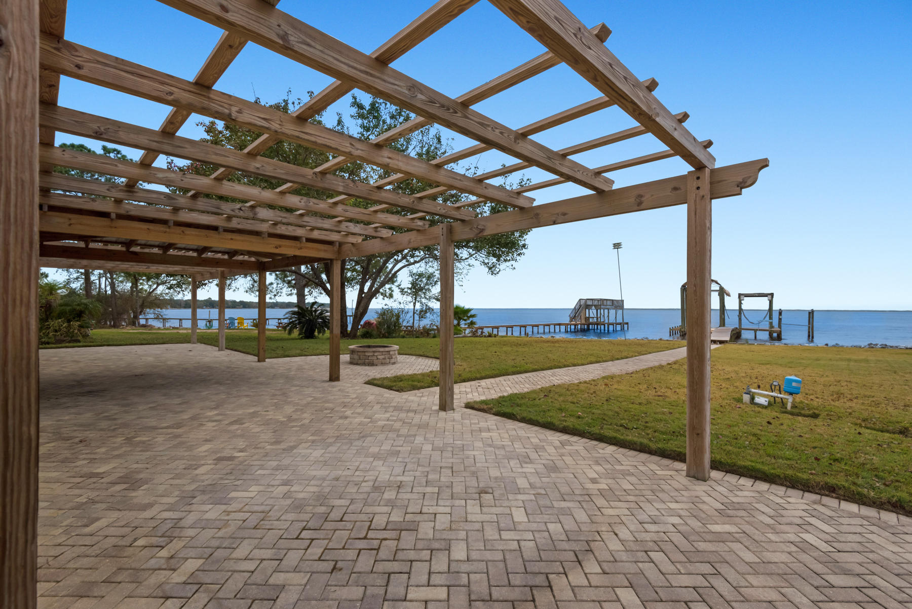 44 Dolphin Place Freeport, FL 32439 - Photo 69 of 76 a view of a backyard with swimming pool