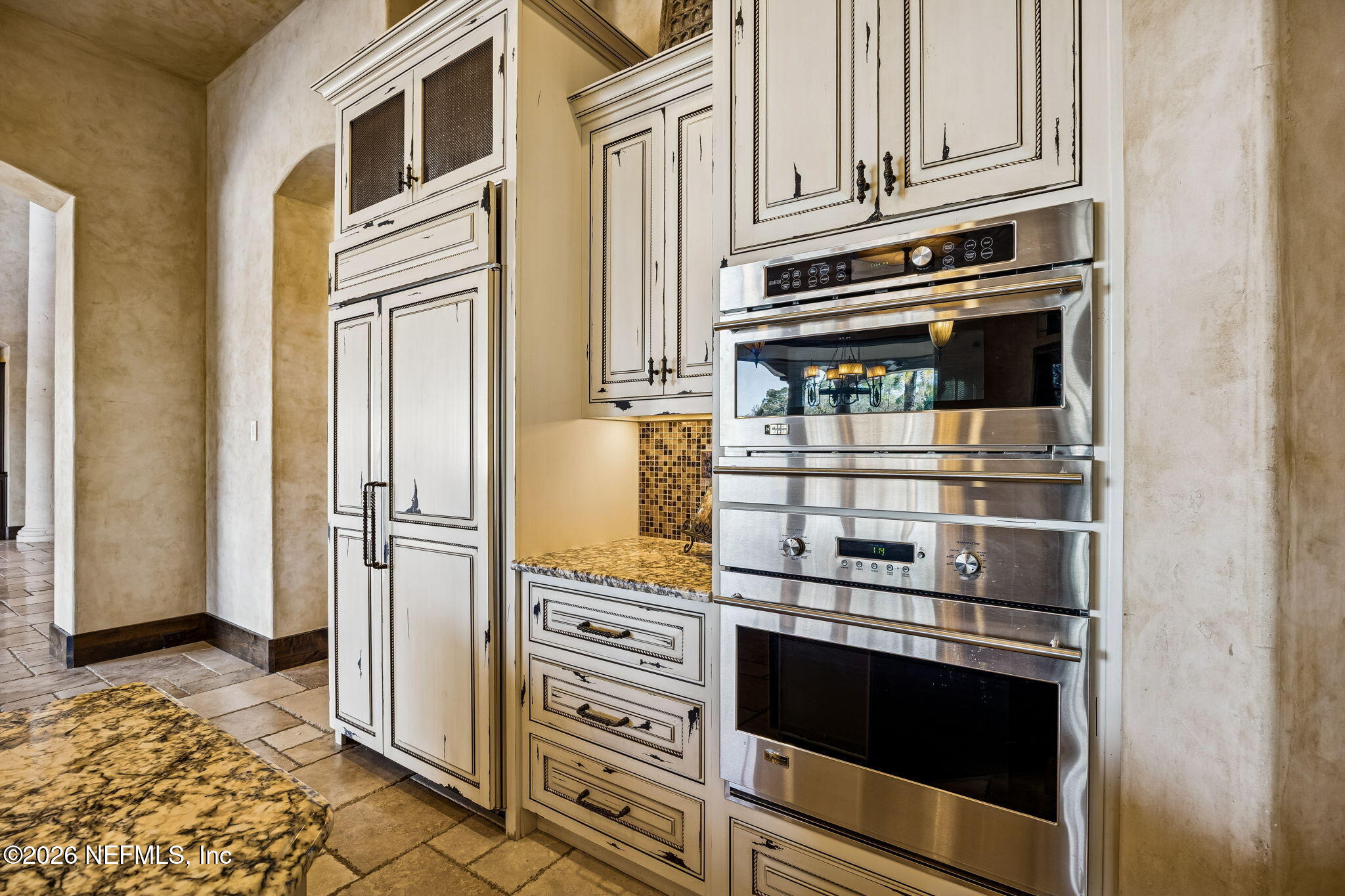 3533 Crest Street St. Augustine, FL 32092 - Photo 21 of 79 a kitchen with granite countertop cabinets and steel stainless steel appliances