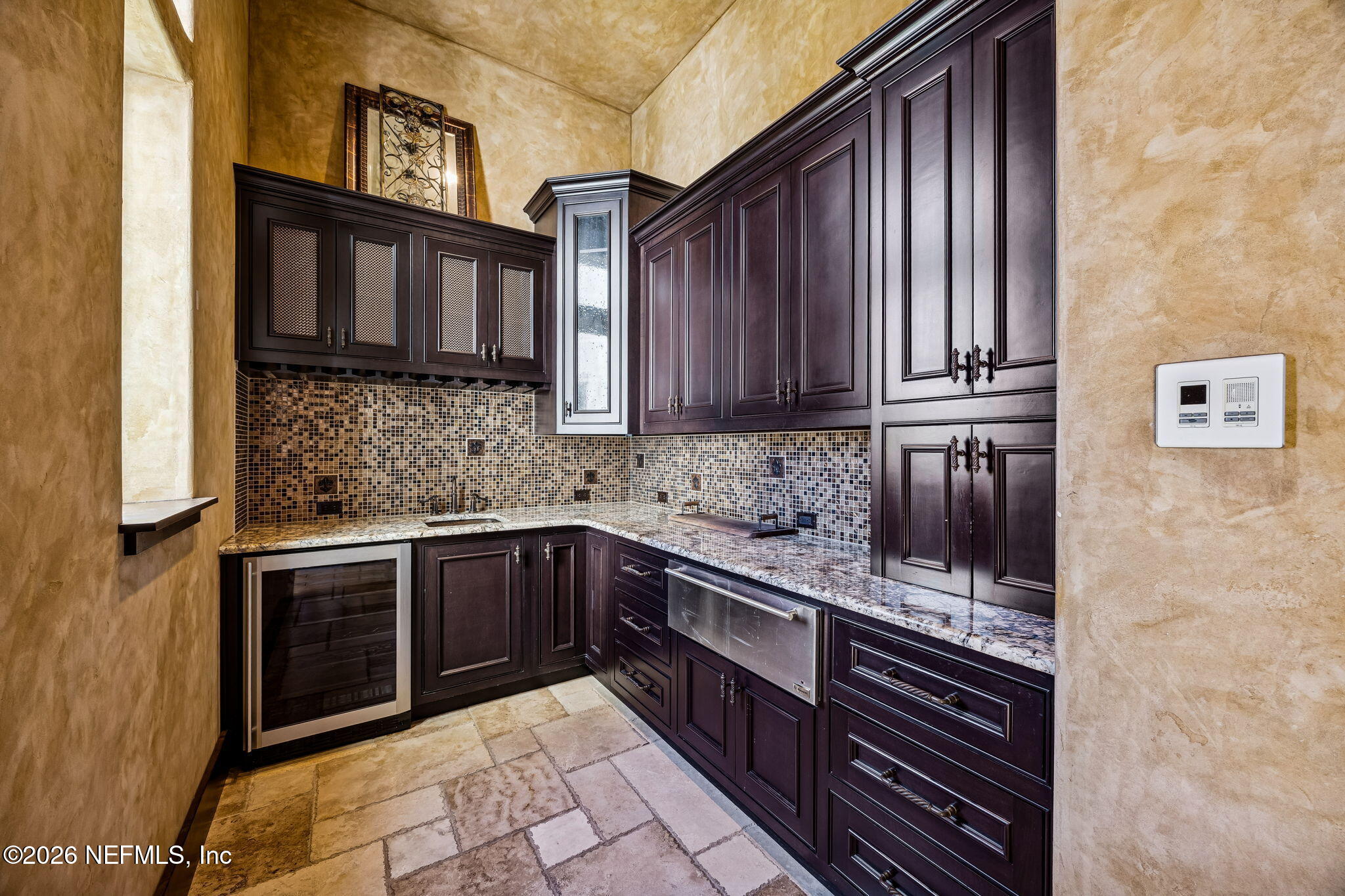 3533 Crest Street St. Augustine, FL 32092 - Photo 22 of 79 a kitchen with stainless steel appliances granite countertop a stove a sink and a microwave