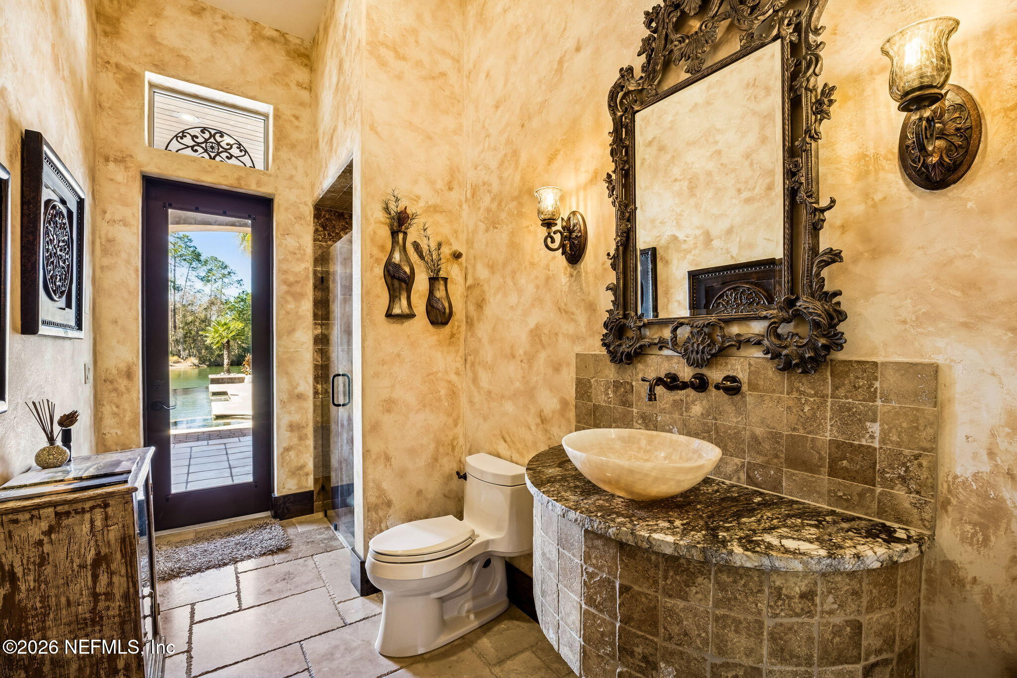3533 Crest Street St. Augustine, FL 32092 - Photo 32 of 79 a bathroom with a granite countertop sink a toilet and shower