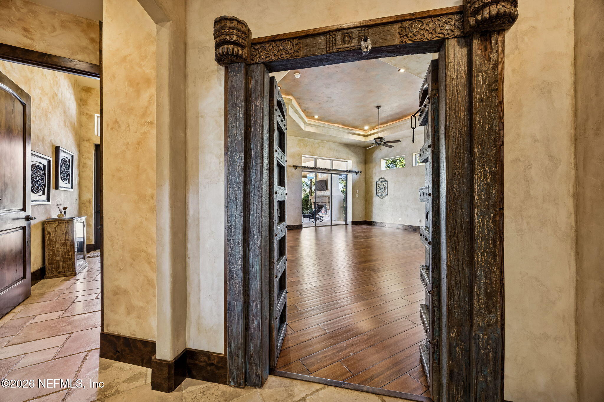 3533 Crest Street St. Augustine, FL 32092 - Photo 34 of 79 a view of a hallway with wooden floor and a living room