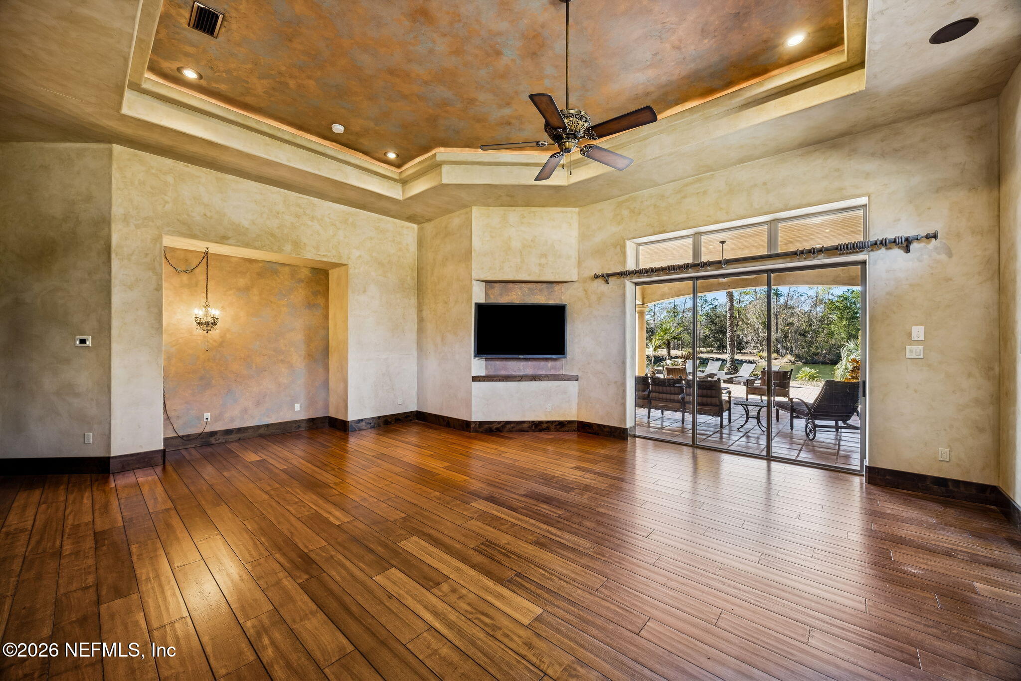 3533 Crest Street St. Augustine, FL 32092 - Photo 35 of 79 a view of a livingroom with wooden floor and a ceiling fan