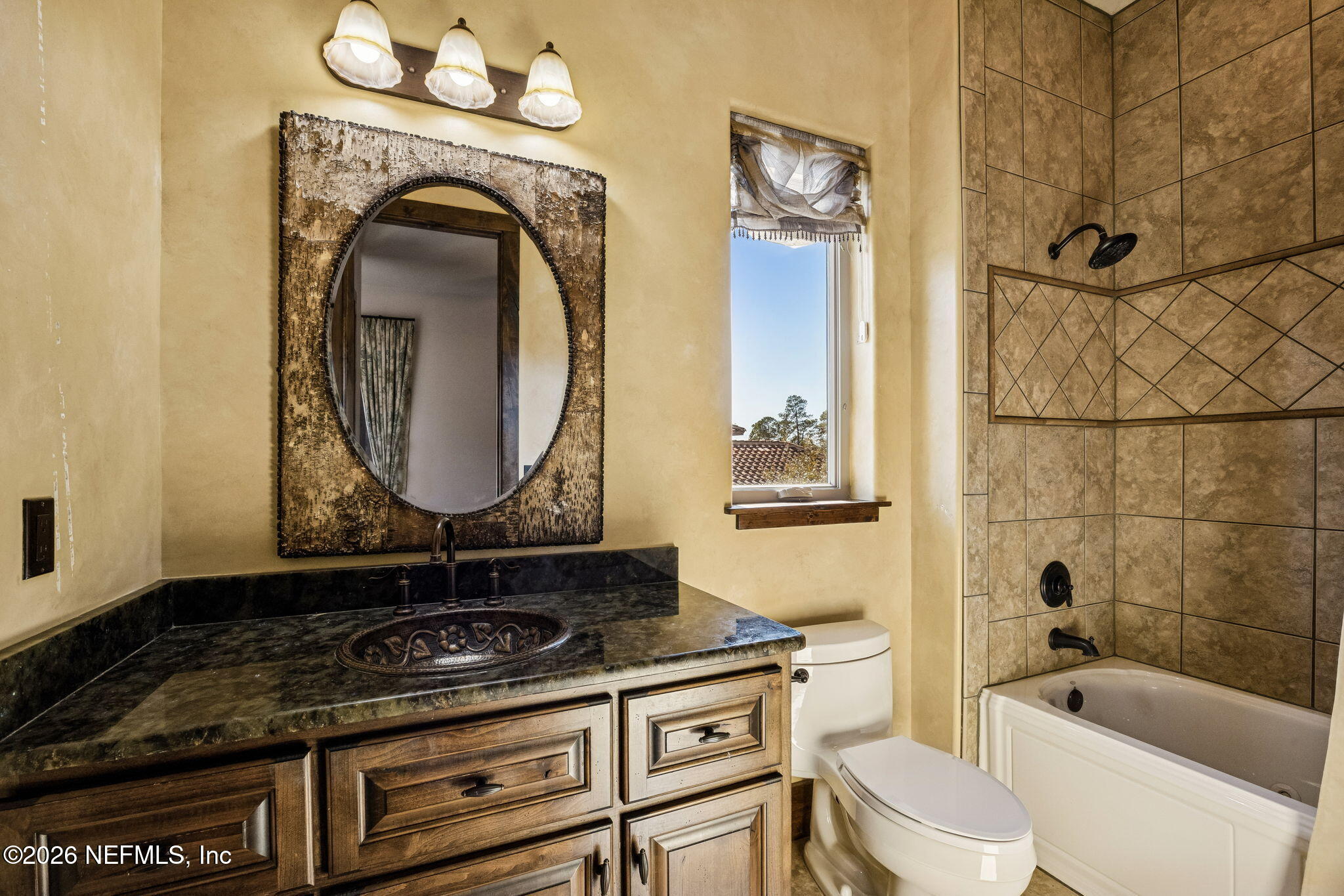 3533 Crest Street St. Augustine, FL 32092 - Photo 54 of 79 a bathroom with a granite countertop double vanity sink a mirror a bathtub and shower