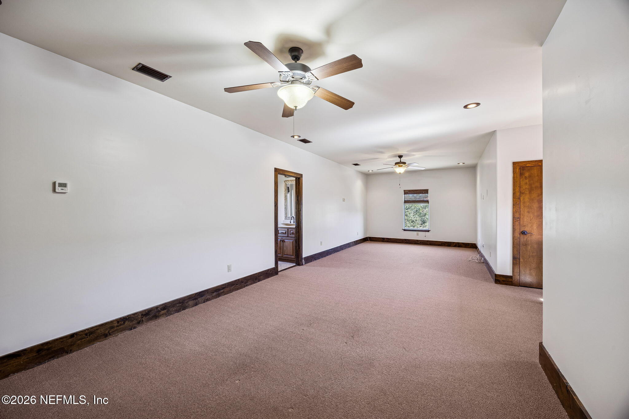 3533 Crest Street St. Augustine, FL 32092 - Photo 62 of 79 a view of a livingroom with a ceiling fan