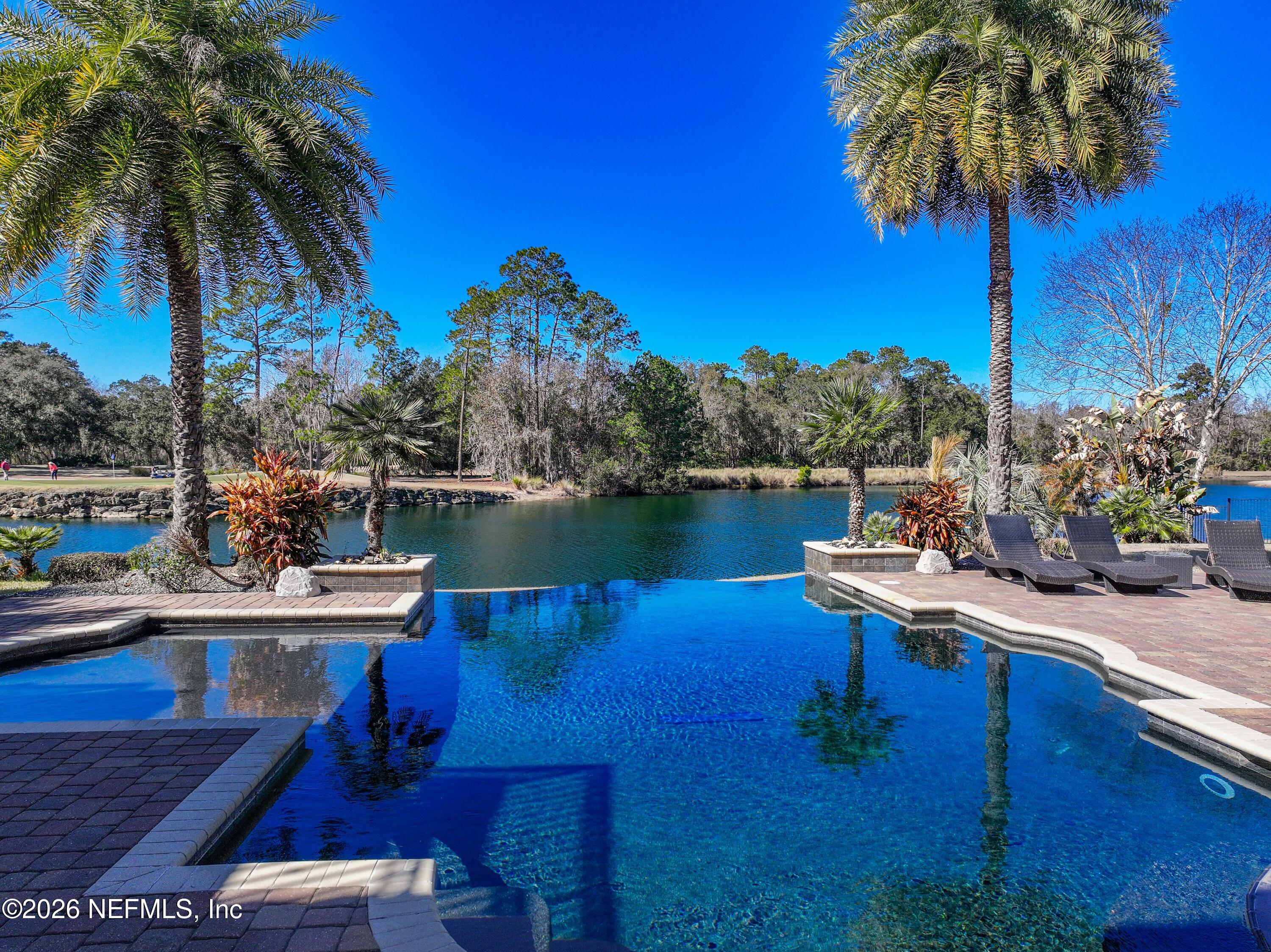 3533 Crest Street St. Augustine, FL 32092 - Photo 65 of 79 a view of a lake with a house in the background