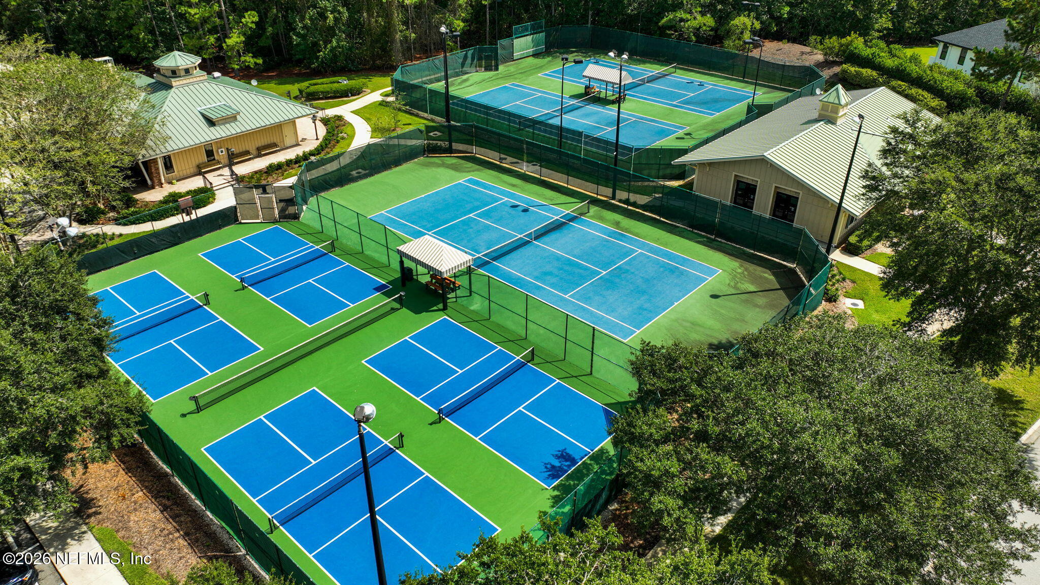 3533 Crest Street St. Augustine, FL 32092 - Photo 78 of 79 an aerial view of a tennis ground with a table and chairs
