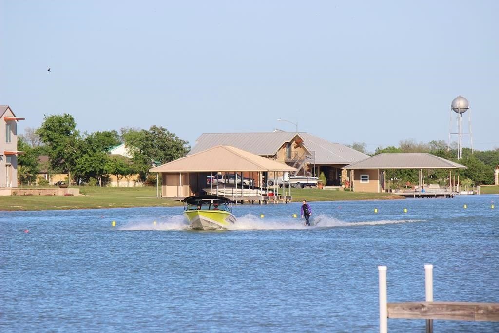 510 River Ranch Circle Martindale, TX 78655 - Photo 12 of 20 a view of pool with lawn chairs under an umbrella