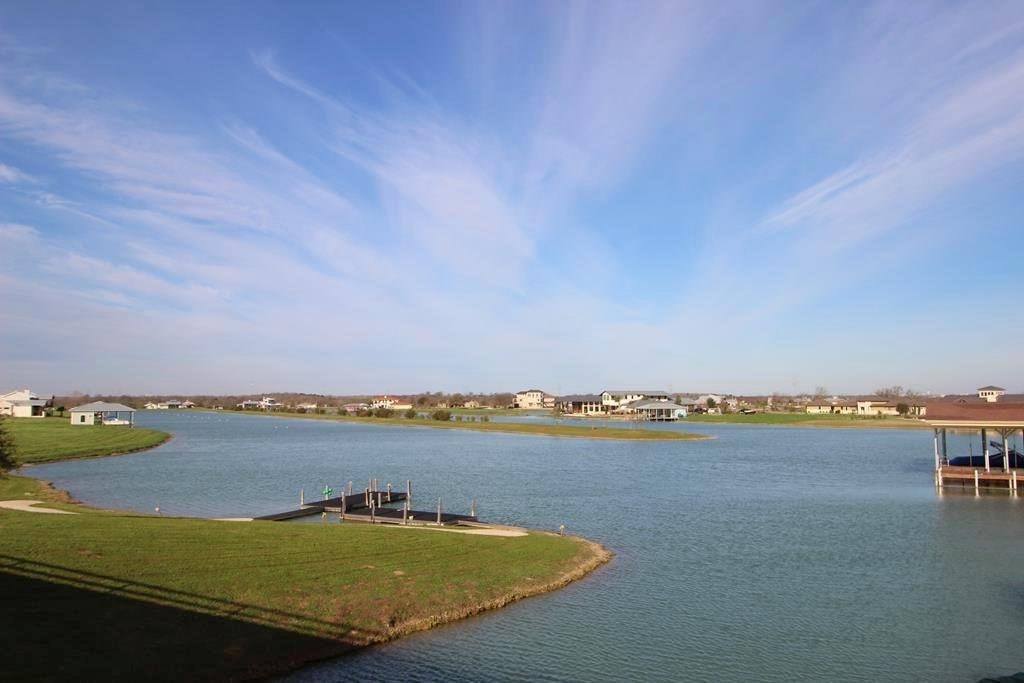 510 River Ranch Circle Martindale, TX 78655 - Photo 18 of 20 a view of a lake with houses in the back