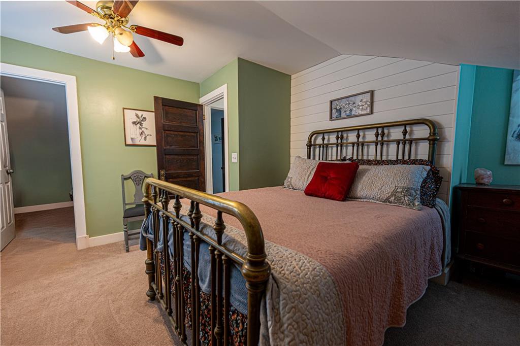 162 Conestoga Road Pittsburgh, PA 15235 - Photo 15 of 25 a bedroom with a bed a baby crib and a chandelier