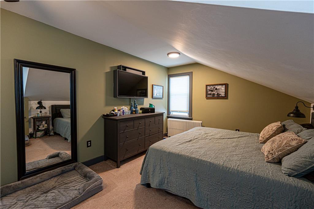 162 Conestoga Road Pittsburgh, PA 15235 - Photo 19 of 25 a bedroom with a bed and a flat screen tv