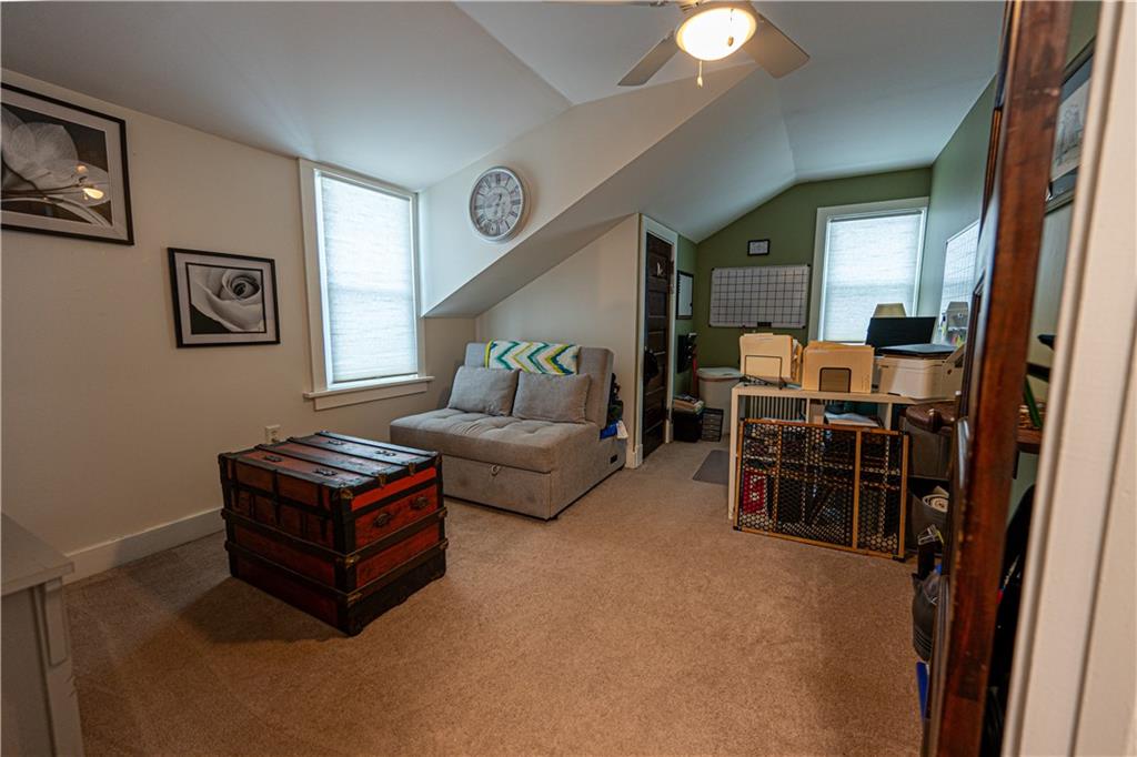 162 Conestoga Road Pittsburgh, PA 15235 - Photo 20 of 25 a living room with furniture and a clock
