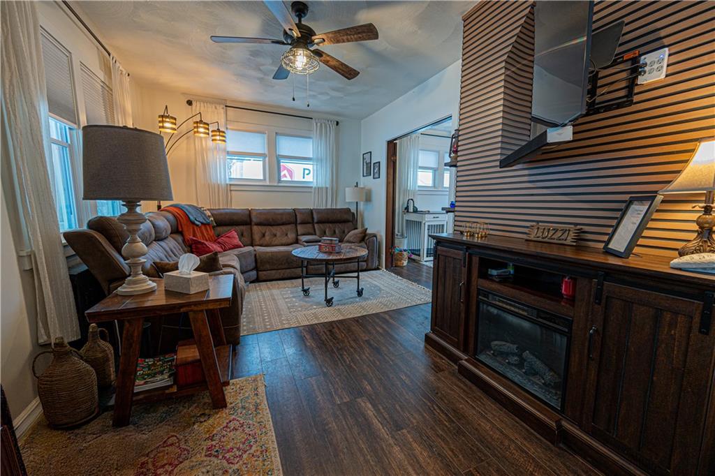162 Conestoga Road Pittsburgh, PA 15235 - Photo 4 of 25 a living room with furniture a fireplace and a window