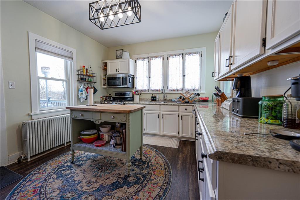 162 Conestoga Road Pittsburgh, PA 15235 - Photo 8 of 25 a kitchen with stainless steel appliances granite countertop a sink stove and cabinets