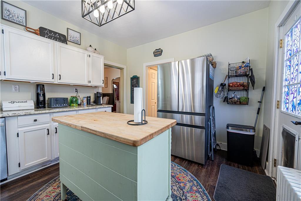 162 Conestoga Road Pittsburgh, PA 15235 - Photo 9 of 25 a kitchen with stainless steel appliances granite countertop a sink refrigerator and cabinets