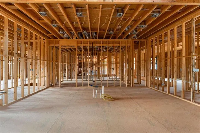 a view of a room with wooden stairs