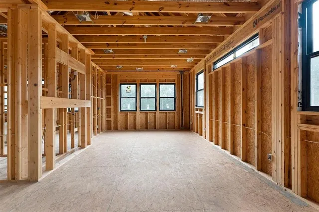 a view of an empty room with windows