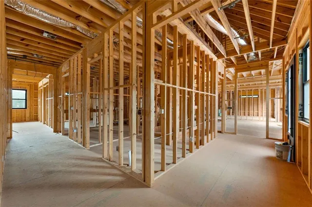 a view of a hall with wooden floors