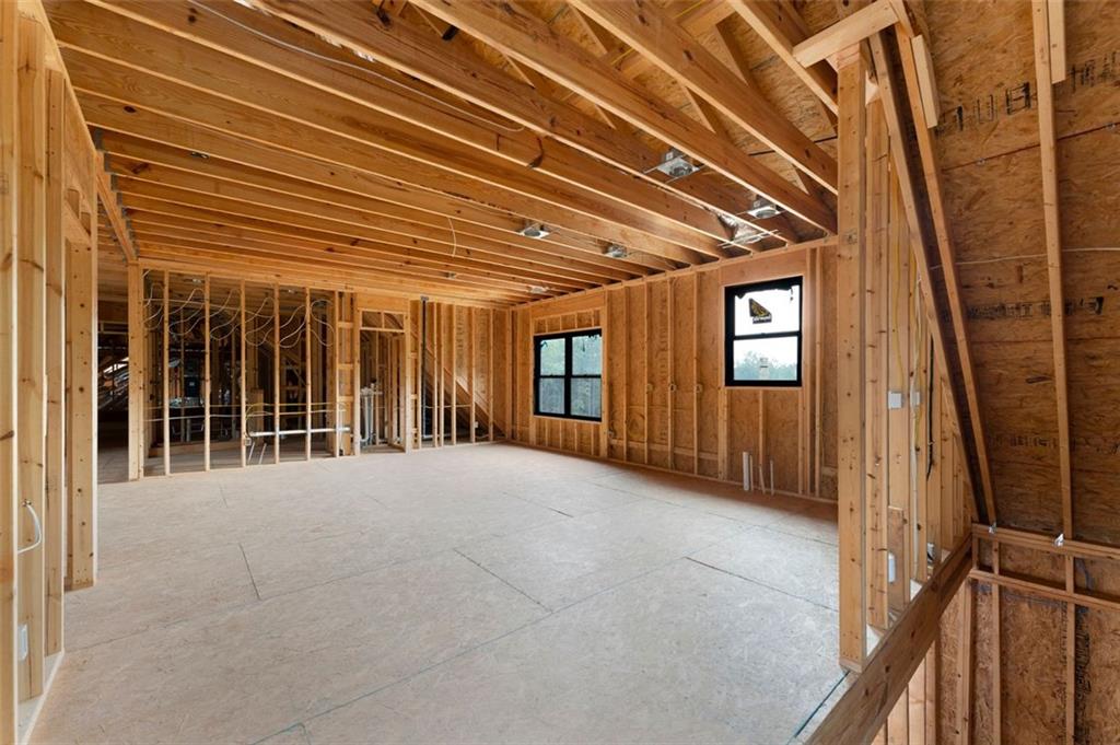 1921 Euharlee Road Kingston, GA 30145 - Photo 47 of 71 a view of an empty room with floor to ceiling windows and stairs