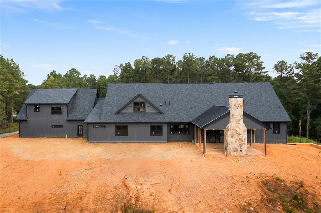 1921 Euharlee Road Kingston, GA 30145 - Photo 59 of 71 a front view of a house with a yard and garage