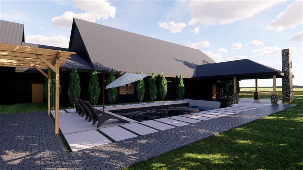 1921 Euharlee Road Kingston, GA 30145 - Photo 66 of 71 a view of a patio with table and chairs under an umbrella