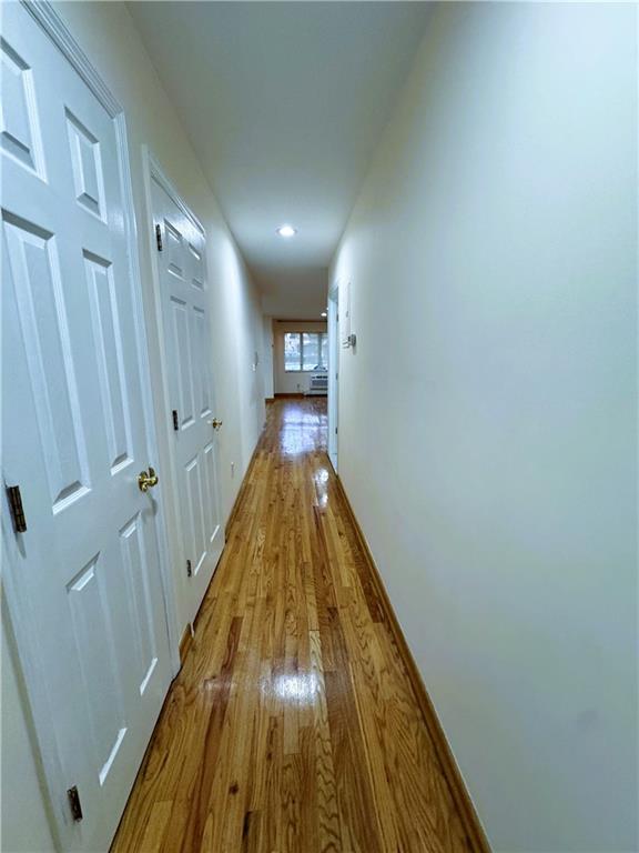 2650 East 26th Street, Unit 1A Brooklyn, NY 11235 - Photo 12 of 14 a view of a hallway with wooden floor