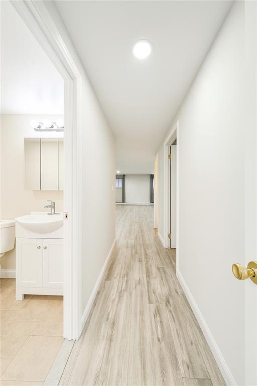 2650 East 26th Street, Unit 1A Brooklyn, NY 11235 - Photo 14 of 14 a view of a kitchen with white cabinets