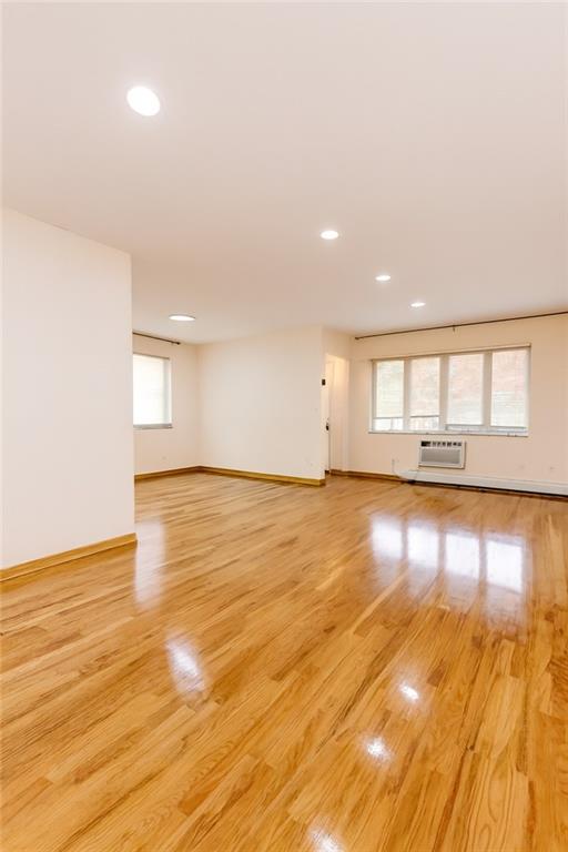 2650 East 26th Street, Unit 1A Brooklyn, NY 11235 - Photo 4 of 14 a view of empty room with wooden floor