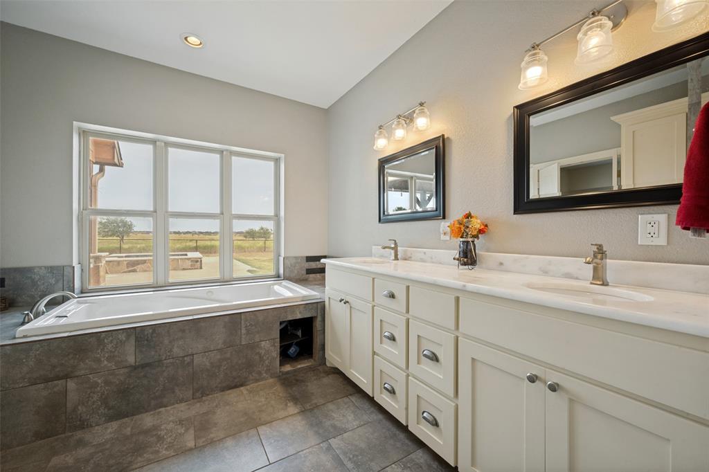 8400 Holder Road Northlake, TX 76247 - Photo 17 of 36 Dual vanity with undermount sinks and light-toned countertops