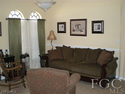 1629 Old Burnt Store Road North Cape Coral, FL 33993 - Photo 3 of 10 a living room with furniture and wooden floor