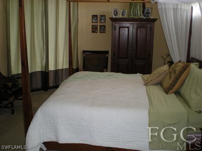 1629 Old Burnt Store Road North Cape Coral, FL 33993 - Photo 4 of 10 a bedroom with a bed and a window