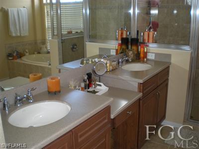1629 Old Burnt Store Road North Cape Coral, FL 33993 - Photo 5 of 10 a bathroom with a sink double vanity and a mirror