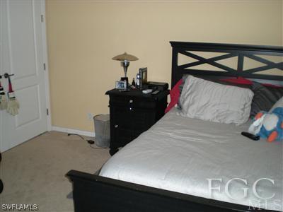 1629 Old Burnt Store Road North Cape Coral, FL 33993 - Photo 7 of 10 a bedroom with a bed and a dresser