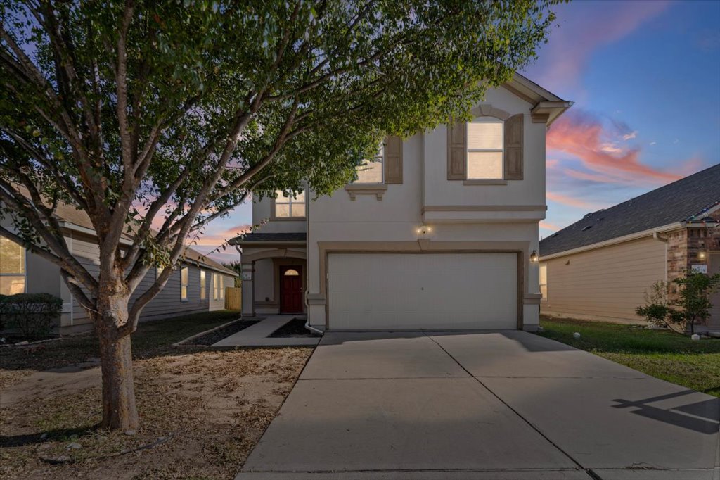 11229 Kirkland Hill Path Austin, TX 78754 - Photo 12 of 15 View of front of home with stucco siding, an attached garage, and concrete driveway