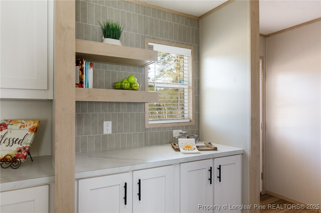 138 Howell Road St. Pauls, NC 28384 - Photo 8 of 23 a bathroom with a sink and mirror