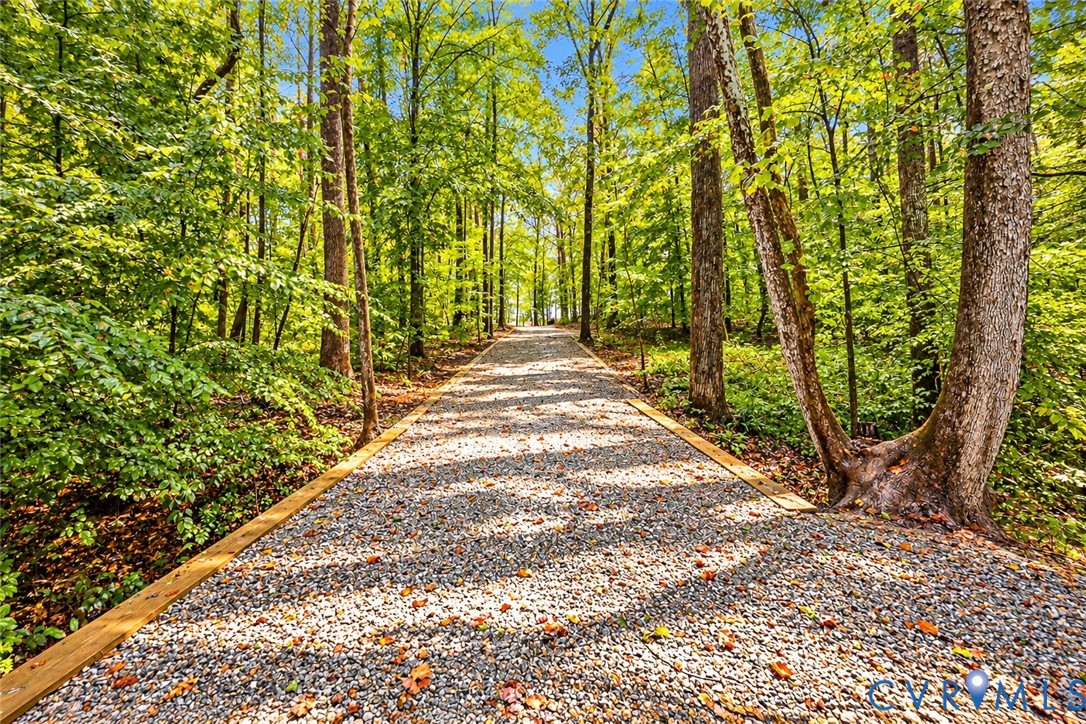 5369 Old Buckingham Road Powhatan, VA 23139 - Photo 7 of 28 Gravel pathway with timber edging, surrounded by m